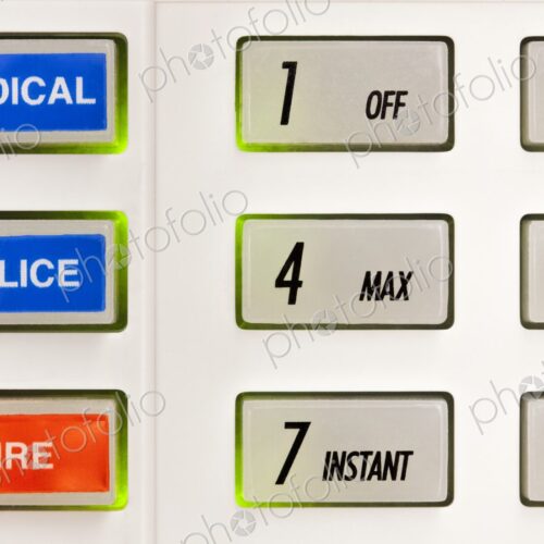 Closeup of buttons on alarm keypad with markings for numbers, medical, police, and fire. Closeup of buttons on alarm keypad with markings for numbers, medical, police, and fire.