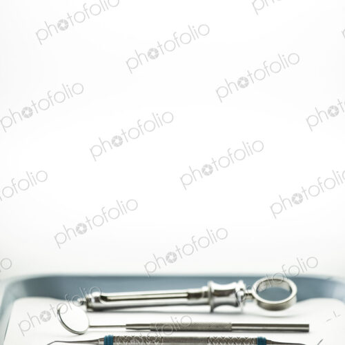 Closeup of medical tools on a tray in a dental surgery. Closeup of medical tools on a tray in a dental surgery.