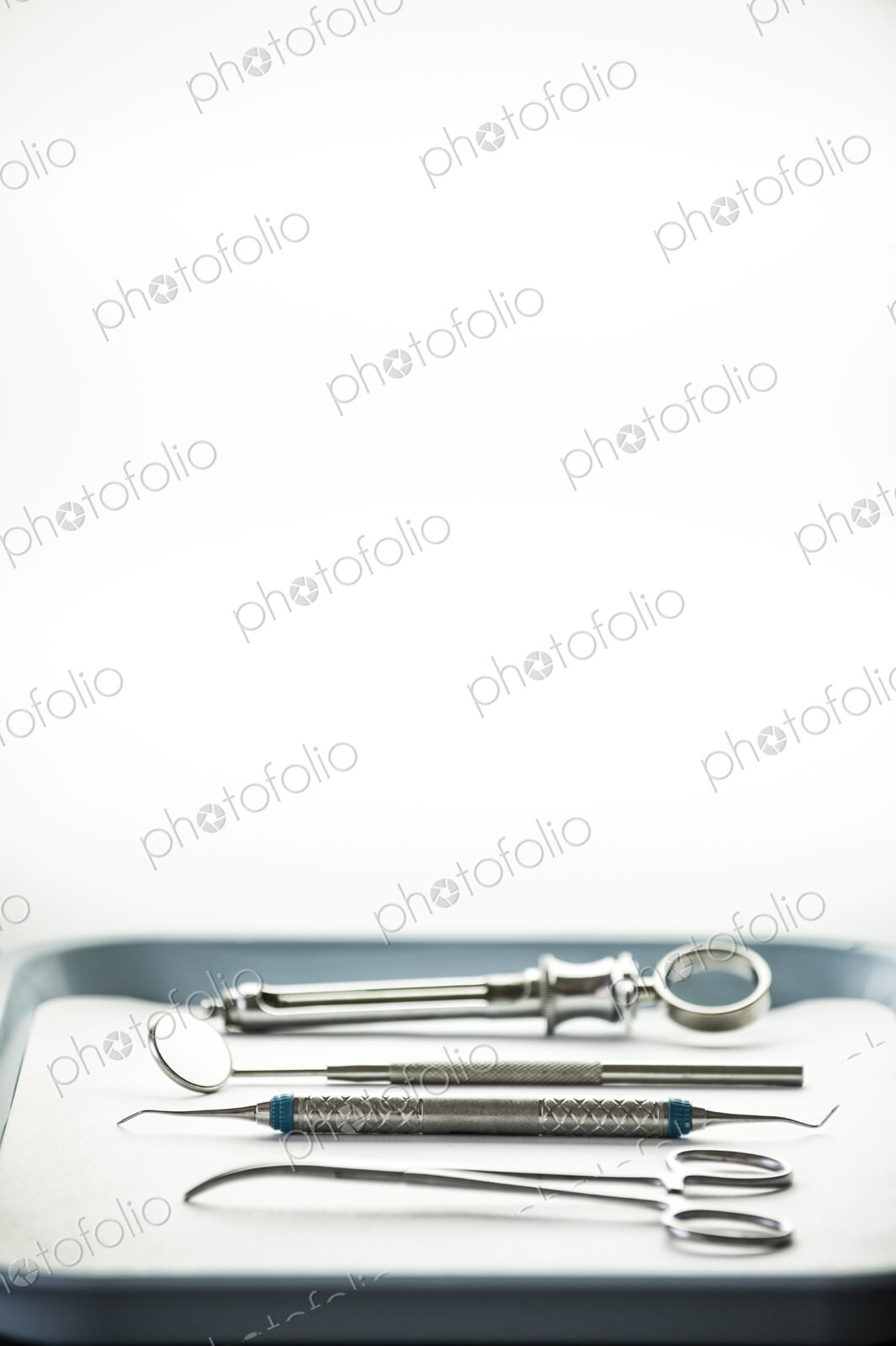 Closeup of medical tools on a tray in a dental surgery.