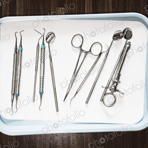 Closeup of medical tools on a tray in a dental surgery. Closeup of medical tools on a tray in a dental surgery.