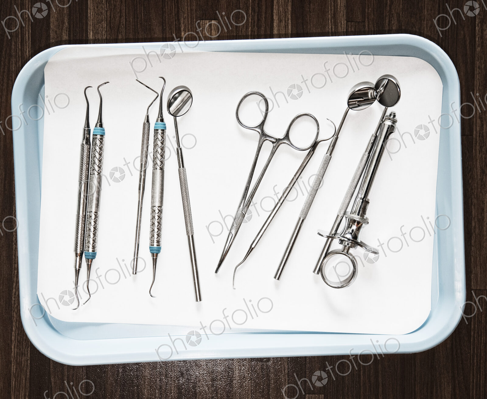 Closeup of medical tools on a tray in a dental surgery.