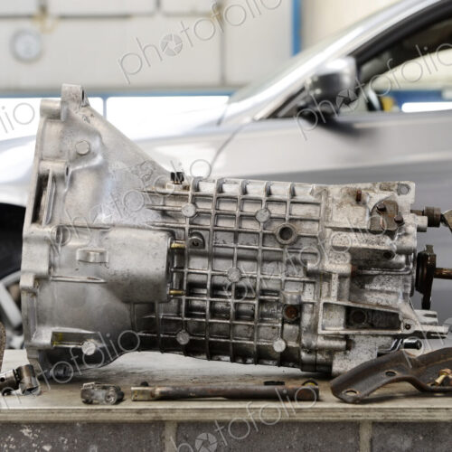 Closeup of motor gear shaft from a car engine at an auto repair shop. Closeup of motor gear shaft from a car engine at an auto repair shop.