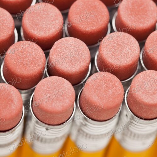 Closeup of rows of new pencil erasers, view from above