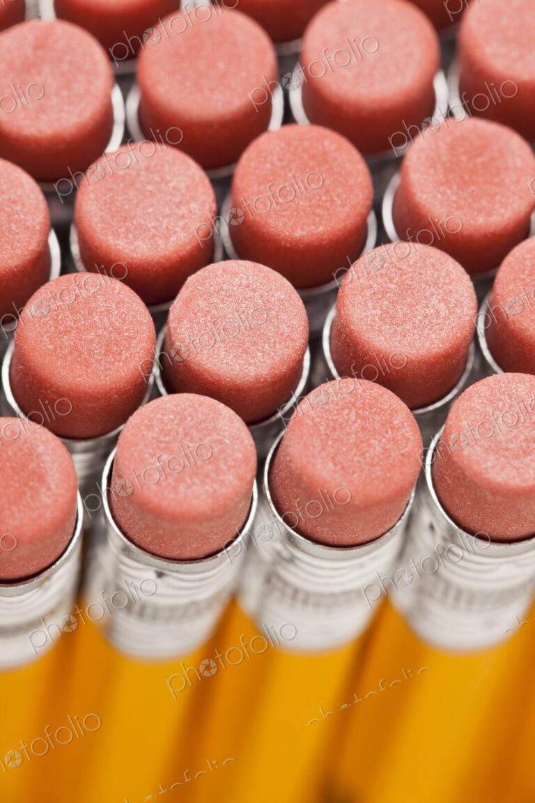 Closeup of rows of new pencil erasers, view from above