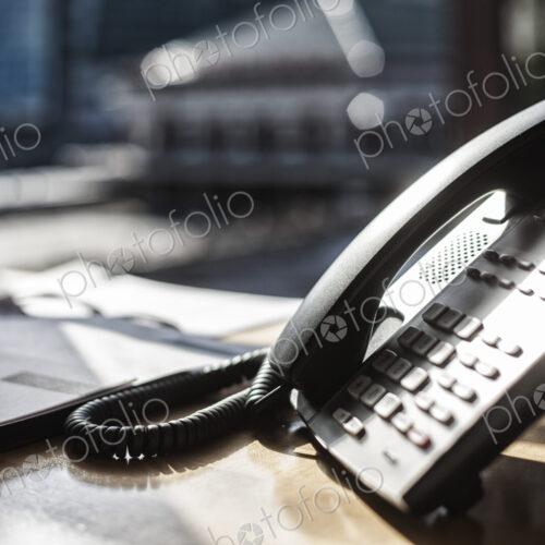 Closeup of telphone and desktop in an office. Closeup of telphone and desktop in an office.