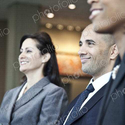 Closeup side view of business people in a meeting with the emphasis on a middle… Closeup side view of business people in a meeting with the emphasis on a middle…