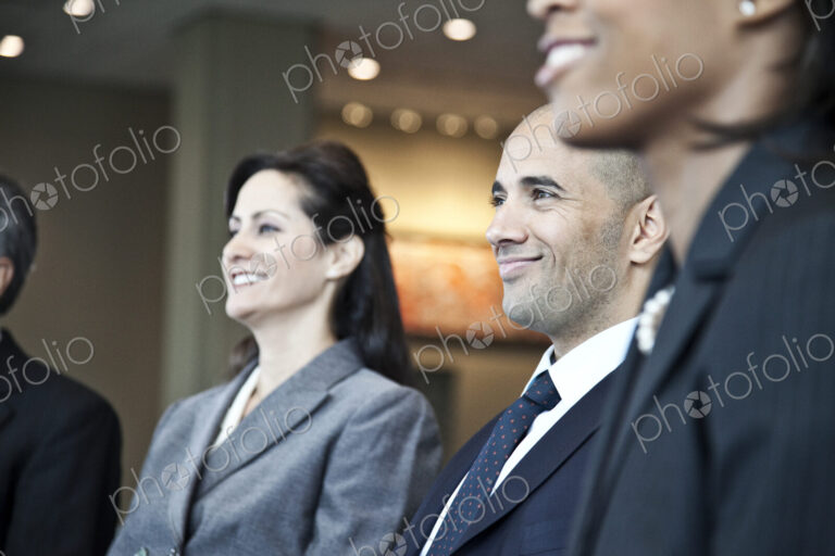 Closeup side view of business people in a meeting with the emphasis on a middle…