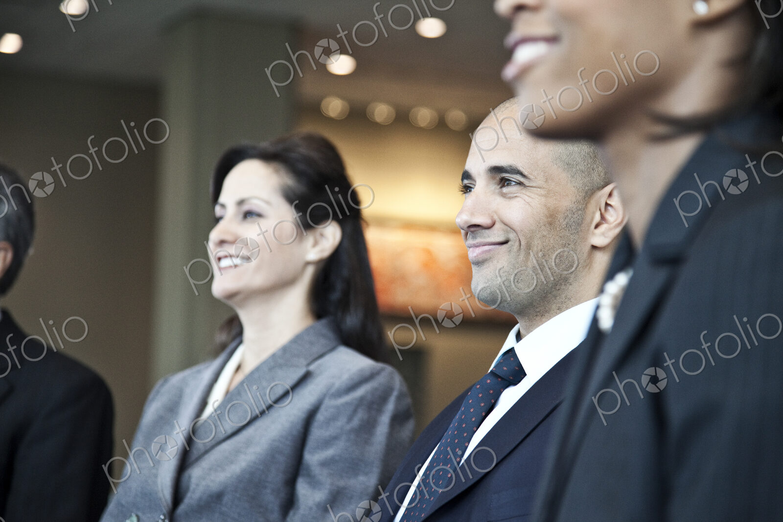 Closeup side view of business people in a meeting with the emphasis on a middle…