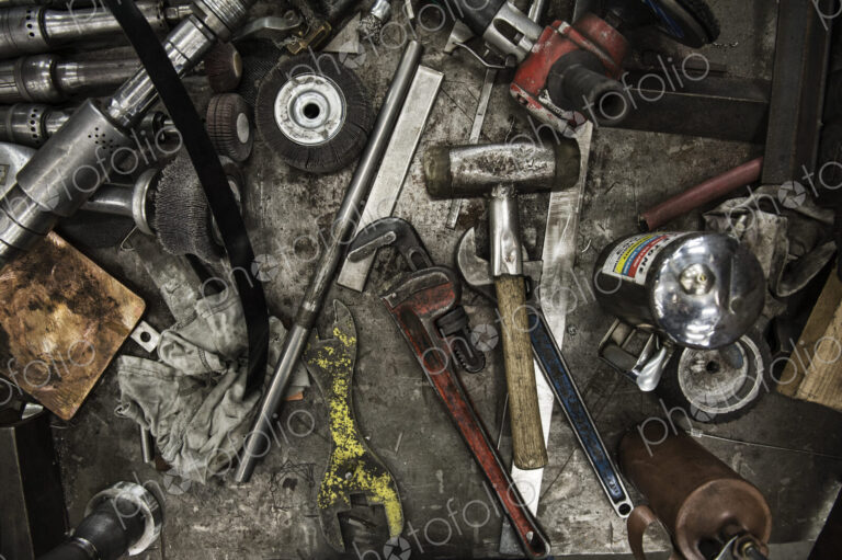 Closeup still life of tools used in a sheet metal factory.