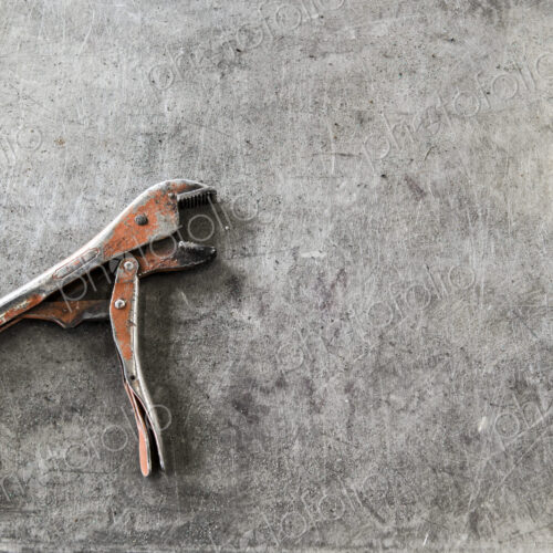 Closeup still life of tools used in a sheet metal factory.