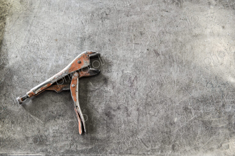 Closeup still life of tools used in a sheet metal factory.