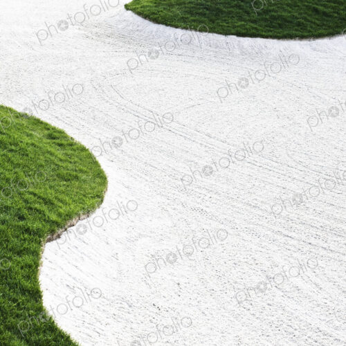 Closeup view of a fairway sand trap on a golf course Closeup view of a fairway sand trap on a golf course