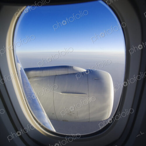 Cloud horizon with engine seen through airplane window. Cloud horizon with engine seen through airplane window.