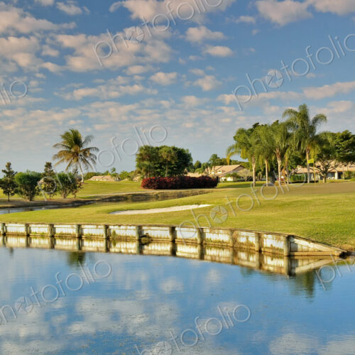 Clouds reflected in calm pond