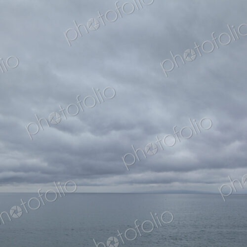 Cloudy day over the Strait of Juan de Fuca, view to the horizon over water.