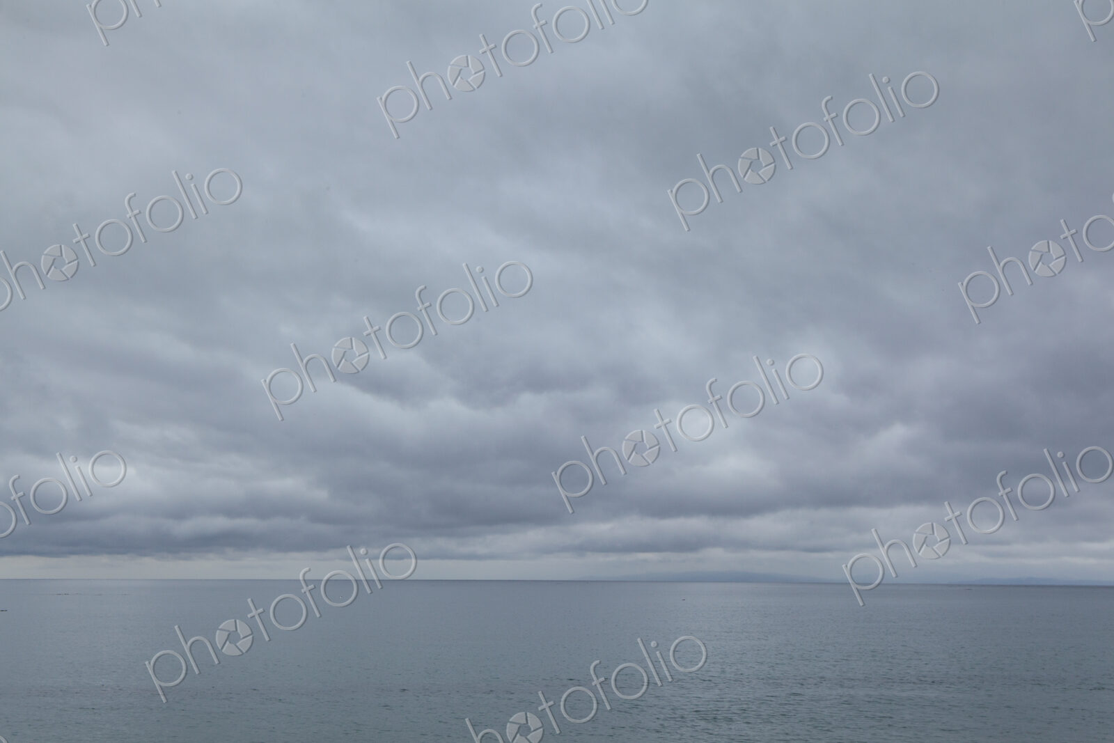 Cloudy day over the Strait of Juan de Fuca, view to the horizon over water.