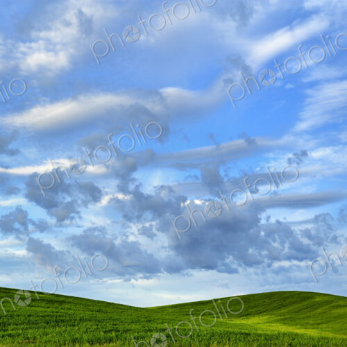 Cloudy sky over rural rolling hills Cloudy sky over rural rolling hills