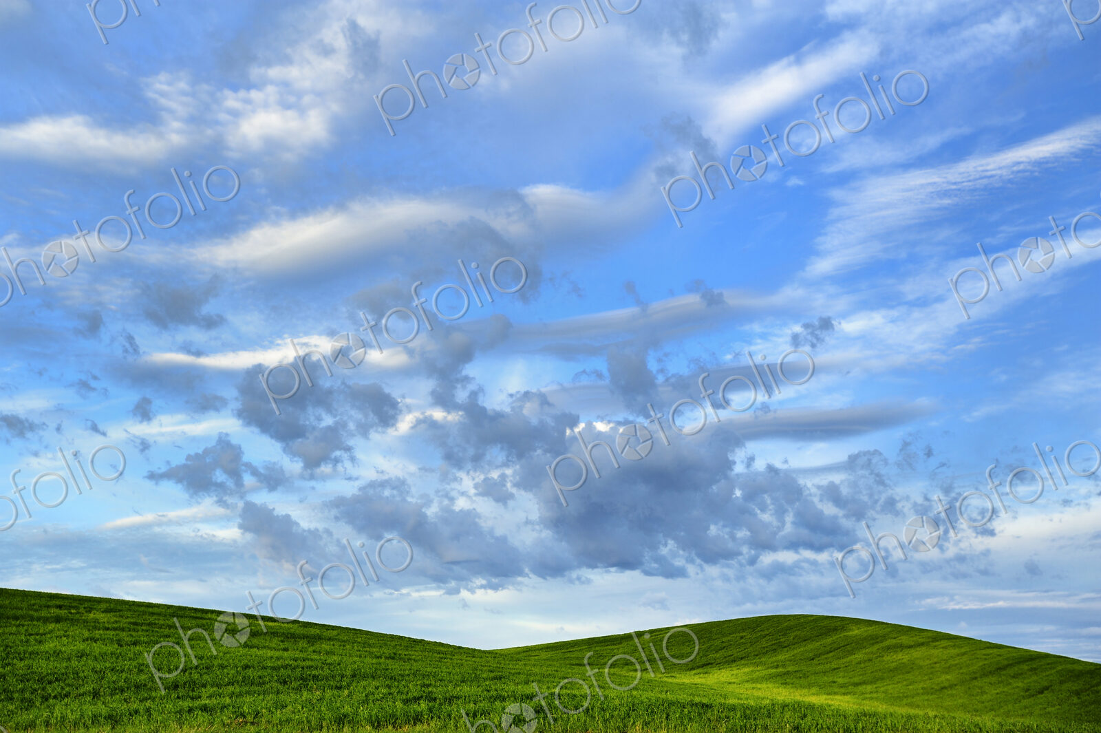 Cloudy sky over rural rolling hills