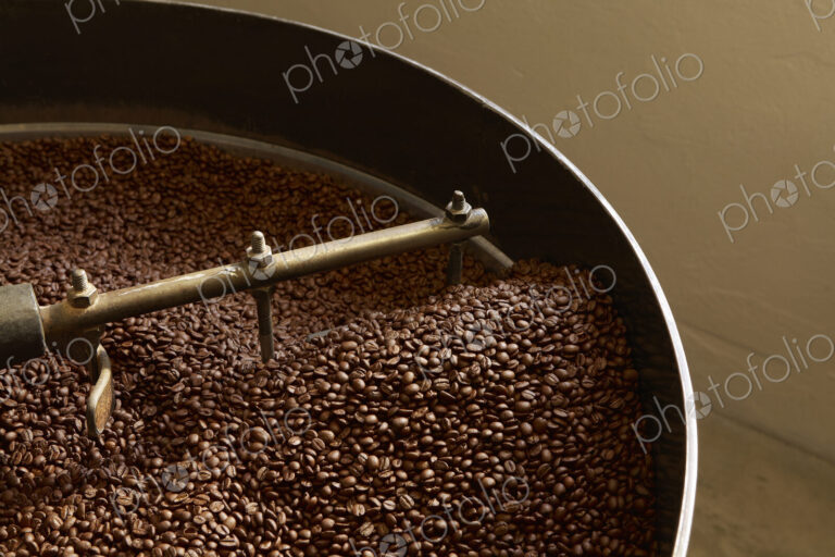 Coffee beans roasting in industrial kettle
