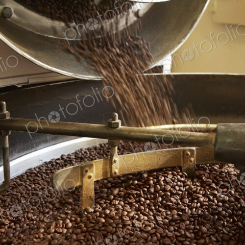 Coffee beans roasting in industrial kettle