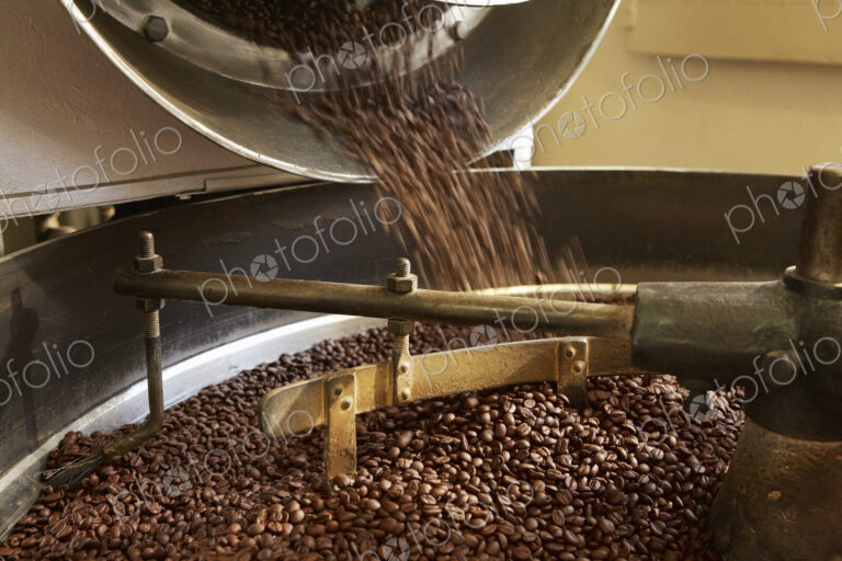 Coffee beans roasting in industrial kettle