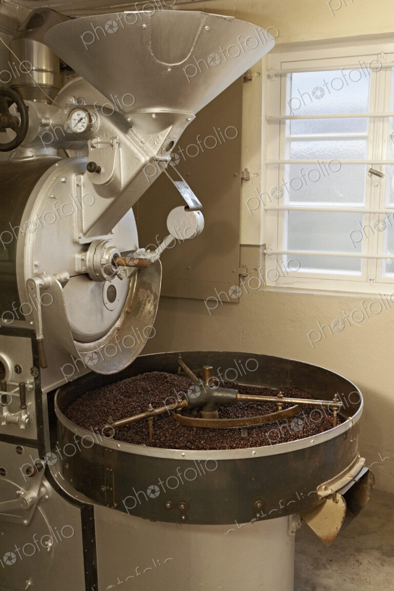 Coffee beans roasting in industrial kettle