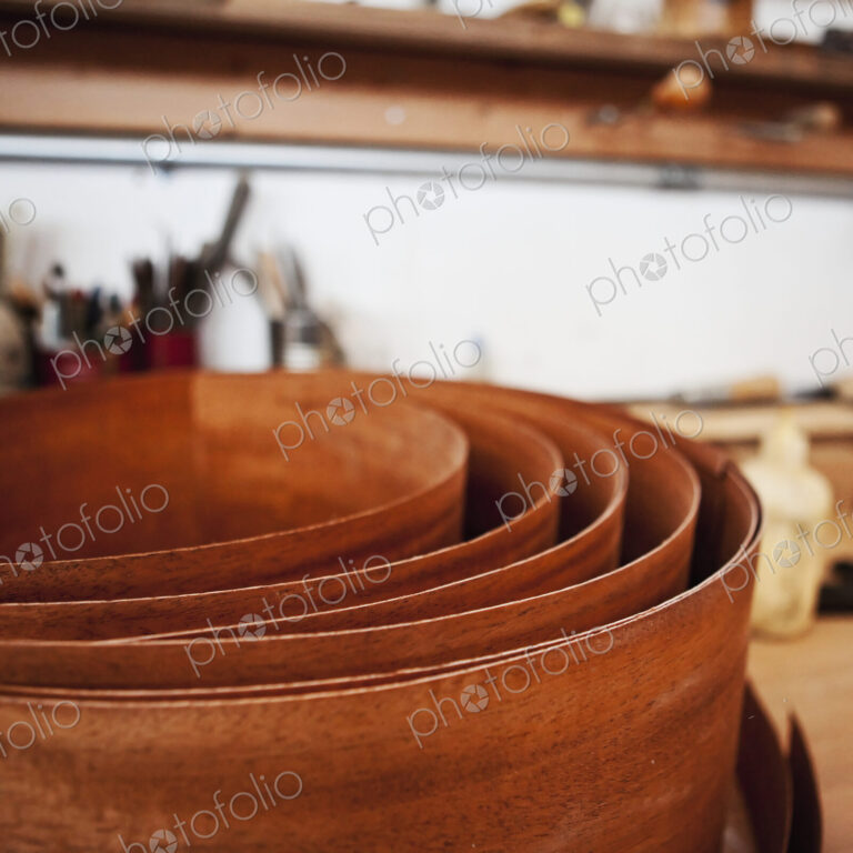 Coil of rusted metal in workshop.