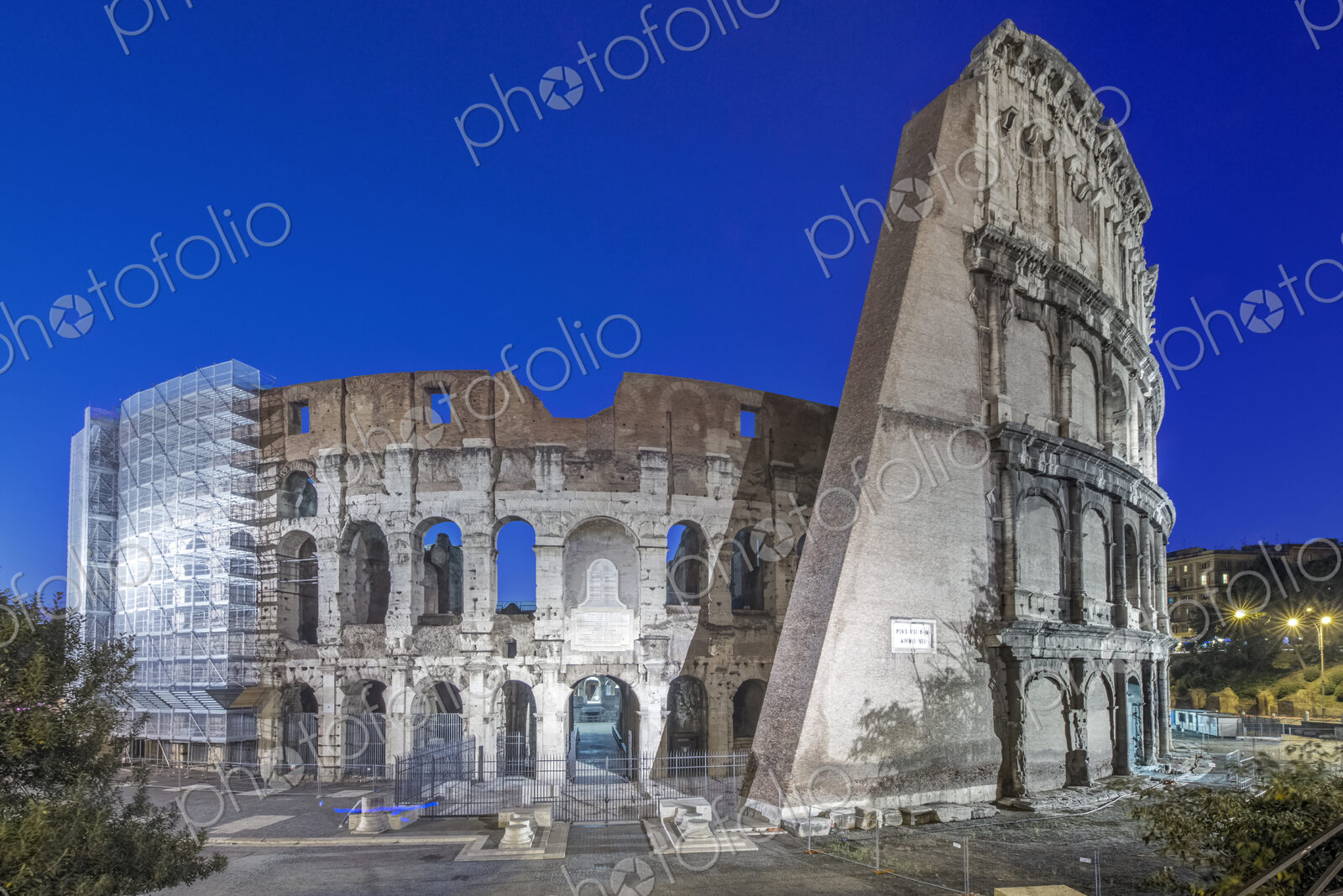 Coliseum ruins illuminated at night, Rome, Italy