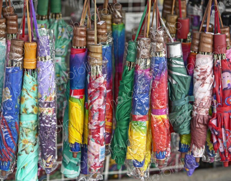 Collapsible Umbrellas Hanging in a Store