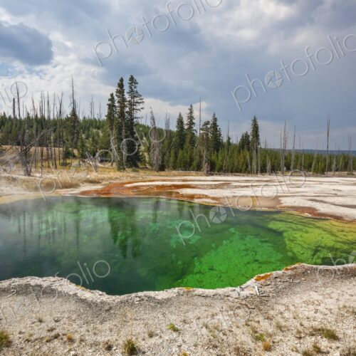 Colorful Abyss Pool in Yellowstone's West Thumb Geyser Basin with steaming hot spring… Colorful Abyss Pool in Yellowstone's West Thumb Geyser Basin with steaming hot spring…