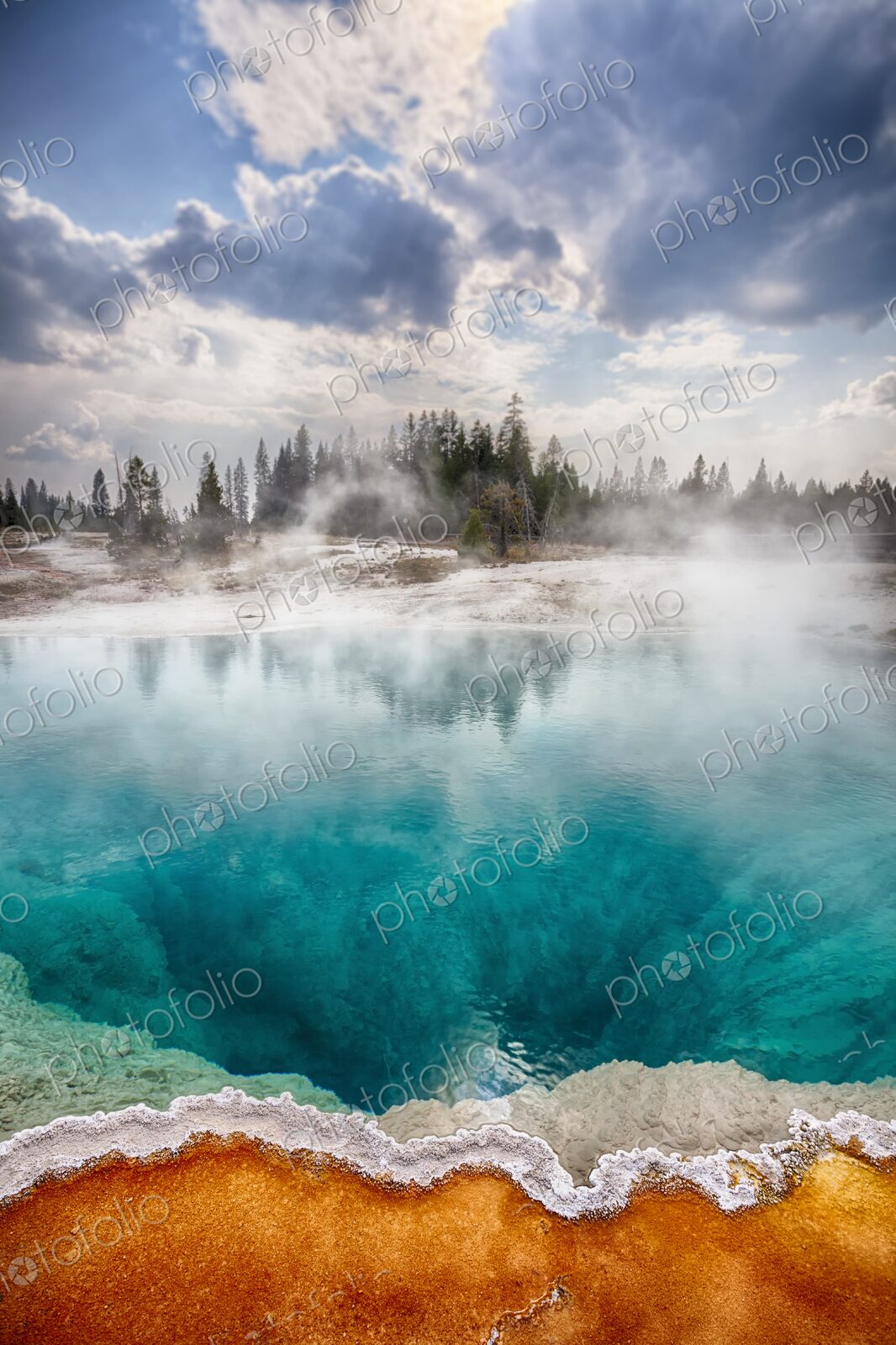 Colorful Black Pool hot spring in Yellowstone’s West Thumb Geyser Basin with vivid…