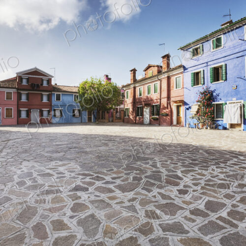 Colorful Homes Surround a Flagstone Plaza Colorful Homes Surround a Flagstone Plaza