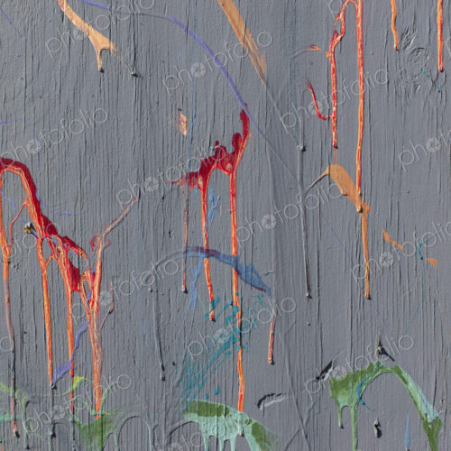 Colorful graffiti paint splattered and dripping on urban wall, close up Colorful graffiti paint splattered and dripping on urban wall, close up