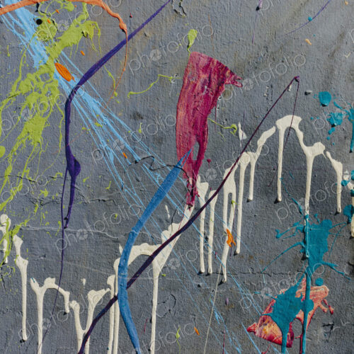 Colorful graffiti paint splattered and dripping on urban wall, close up Colorful graffiti paint splattered and dripping on urban wall, close up