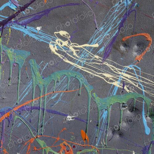 Colorful graffiti paint splattered and dripping on urban wall, close up Colorful graffiti paint splattered and dripping on urban wall, close up