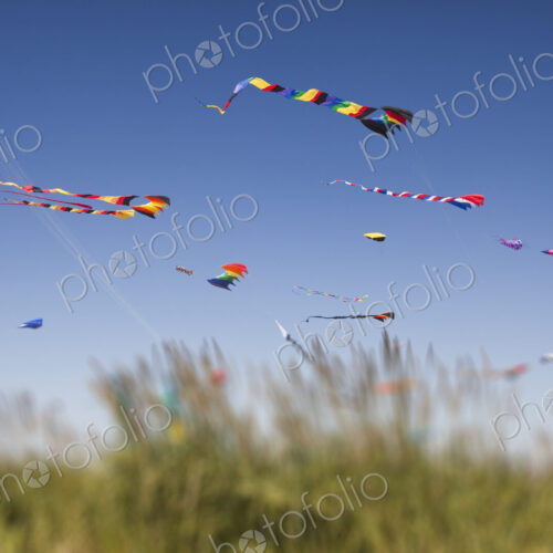 Colorful kites flying at a kite festival. Colorful kites flying at a kite festival.