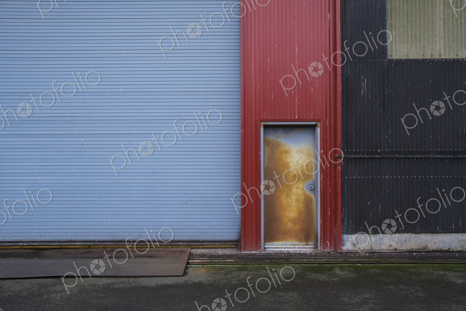 Colorfully painted warehouse exterior, doorway and loading area, Seattle, Washington