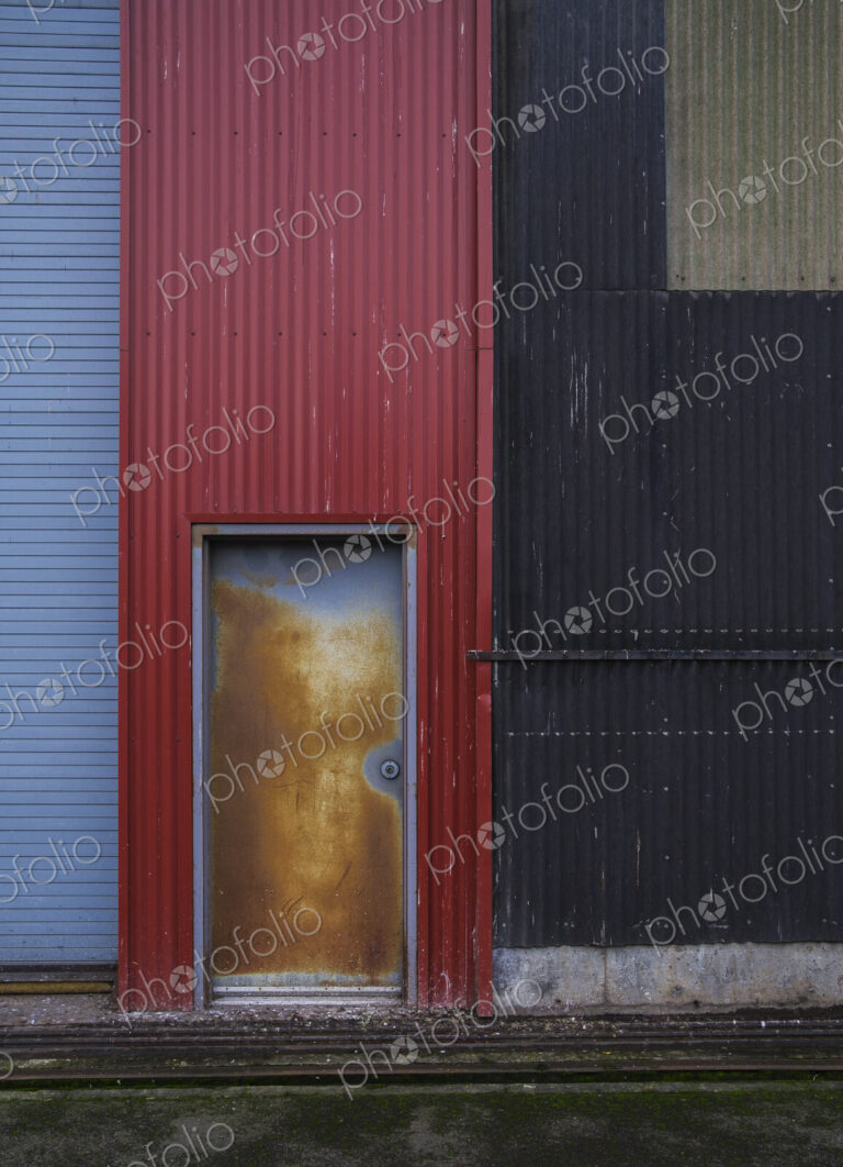 Colorfully painted warehouse exterior, doorway and loading area, Seattle, Washington