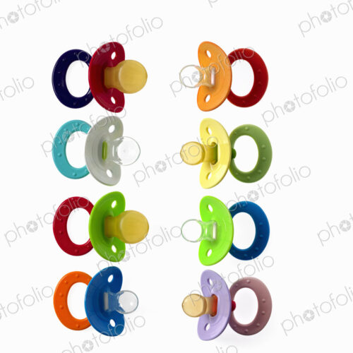 Coloured plastic baby pacifiers, dummies or soothers.
