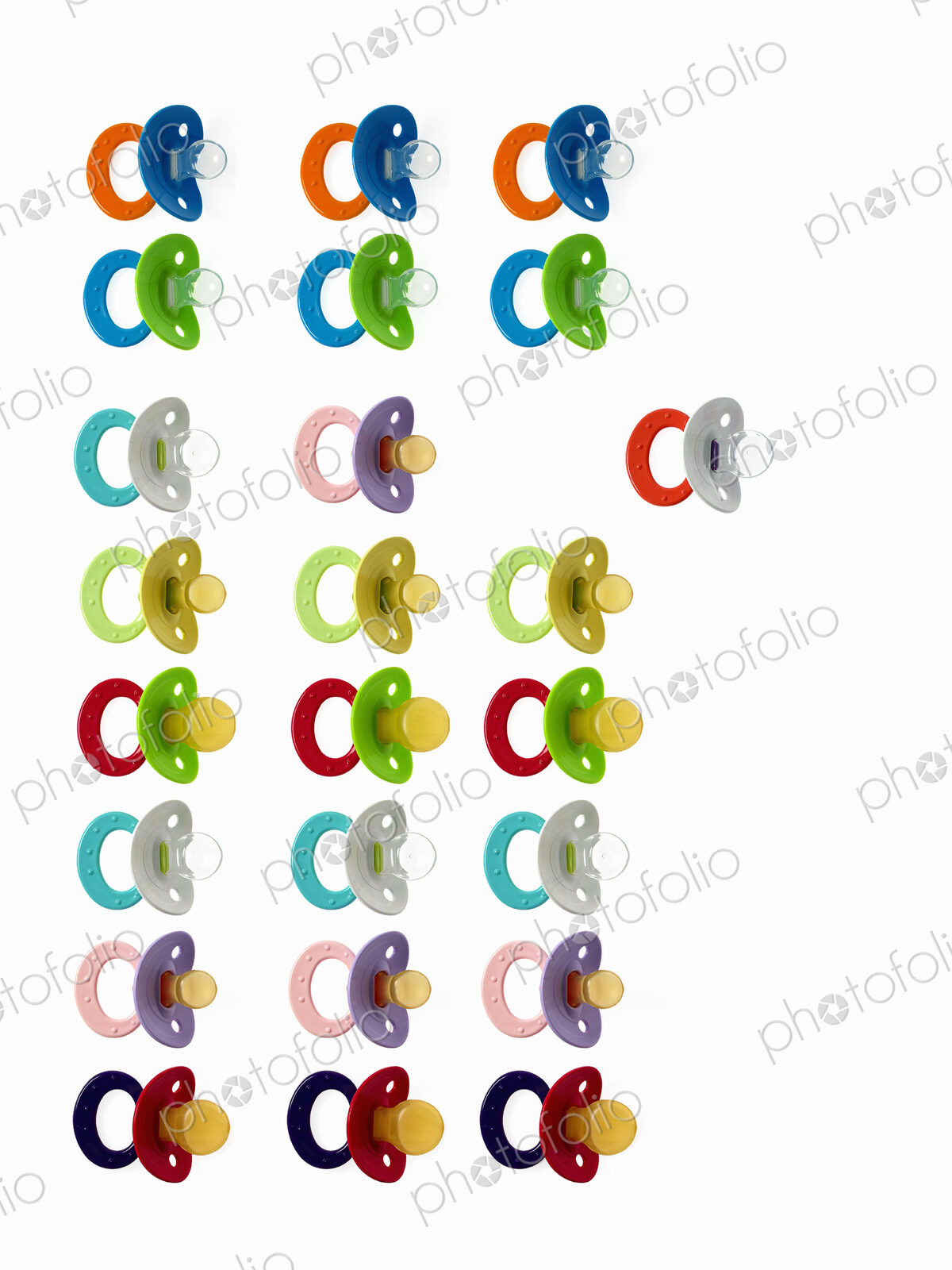 Coloured plastic baby pacifiers, dummies or soothers.