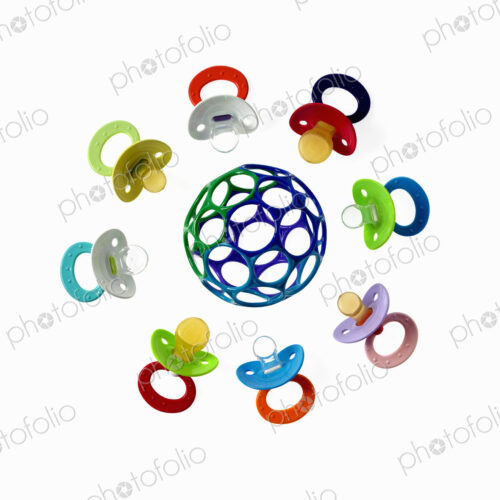 Coloured plastic baby pacifiers, dummies or soothers. Coloured plastic baby pacifiers, dummies or soothers.
