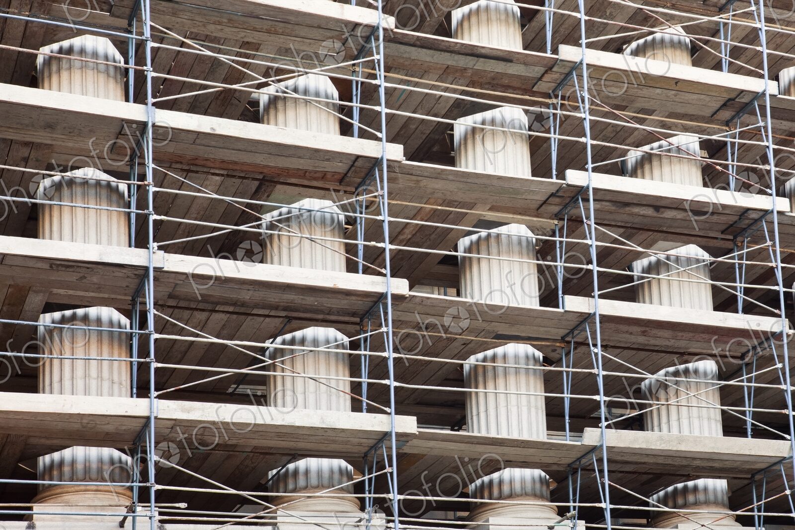 Columns of a public building covered in scaffolding, Sacramento, California.
