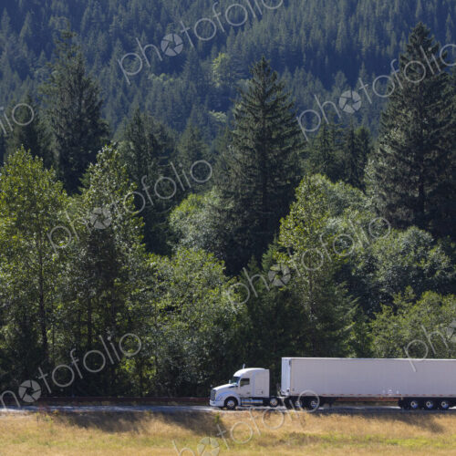 Commercial truck on a highway in the mountains east of Seattle, Washington USA