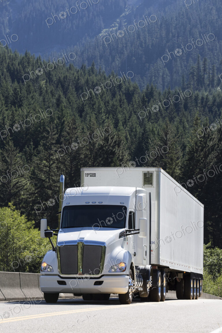 Commercial truck on a highway in the mountains east of Seattle, Washington USA