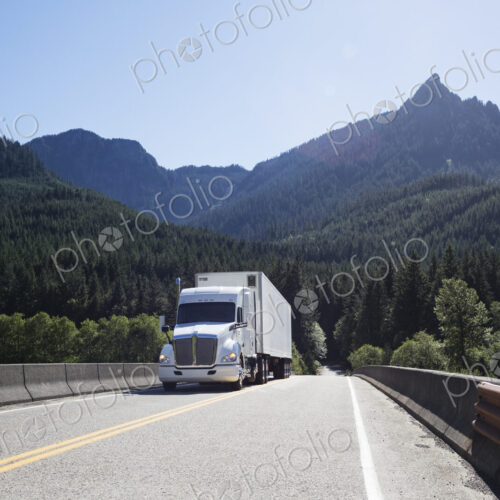 Commercial truck on a highway in the mountains east of Seattle, Washington USA