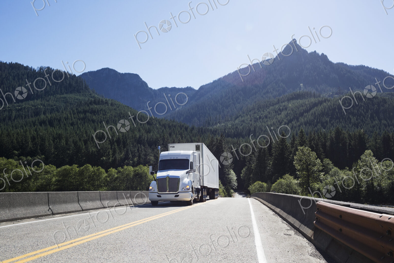Commercial truck on a highway in the mountains east of Seattle, Washington USA