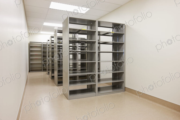 Computer server cabinets in empty office.