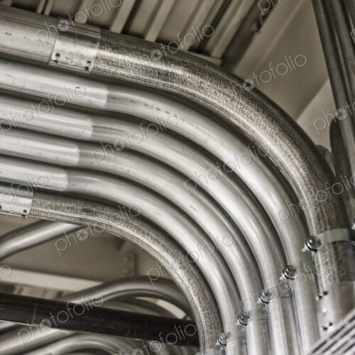 Computer server farm piping used to organize Cat 5 cables and power cables in a… Computer server farm piping used to organize Cat 5 cables and power cables in a…