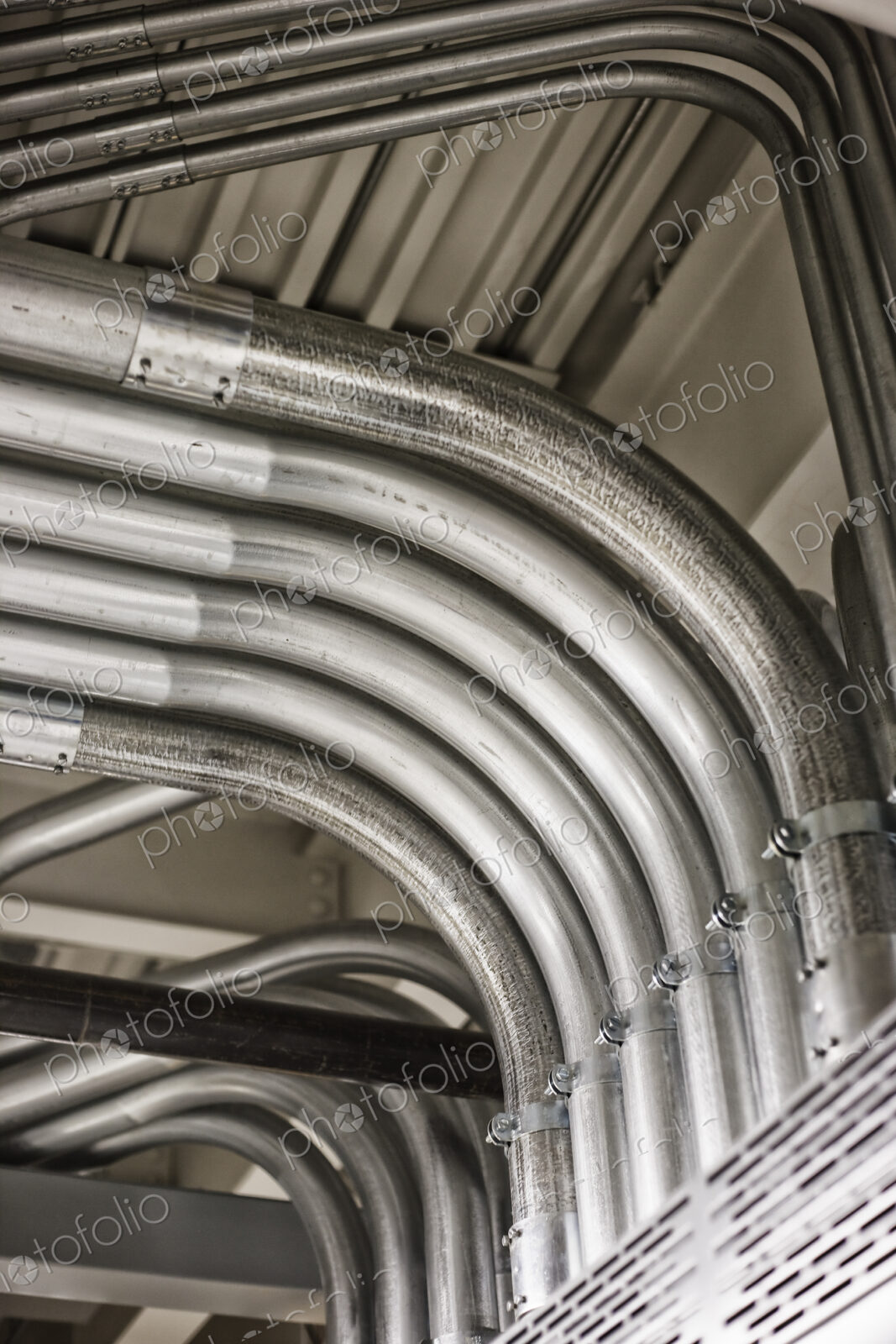 Computer server farm piping used to organize Cat 5 cables and power cables in a…
