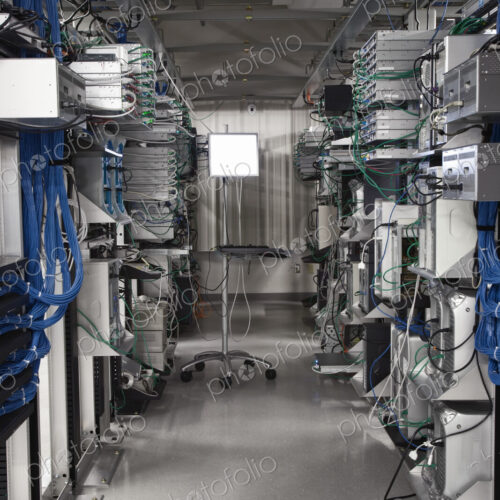 Computer server towers in racks in a computer server farm. Computer server towers in racks in a computer server farm.